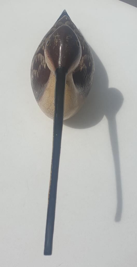 Carved painted wooden curlew