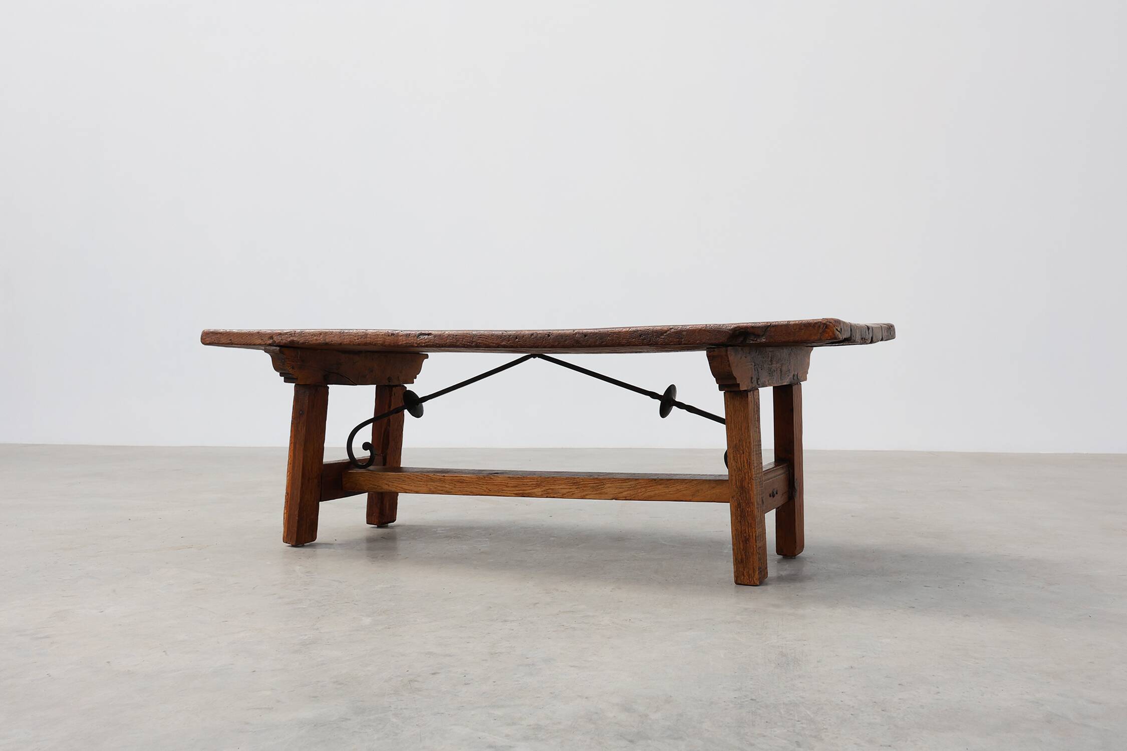 17th Century Spanish Brutalist coffee table in wood and wrought iron