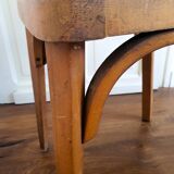 Baumann chair stamped in red skai