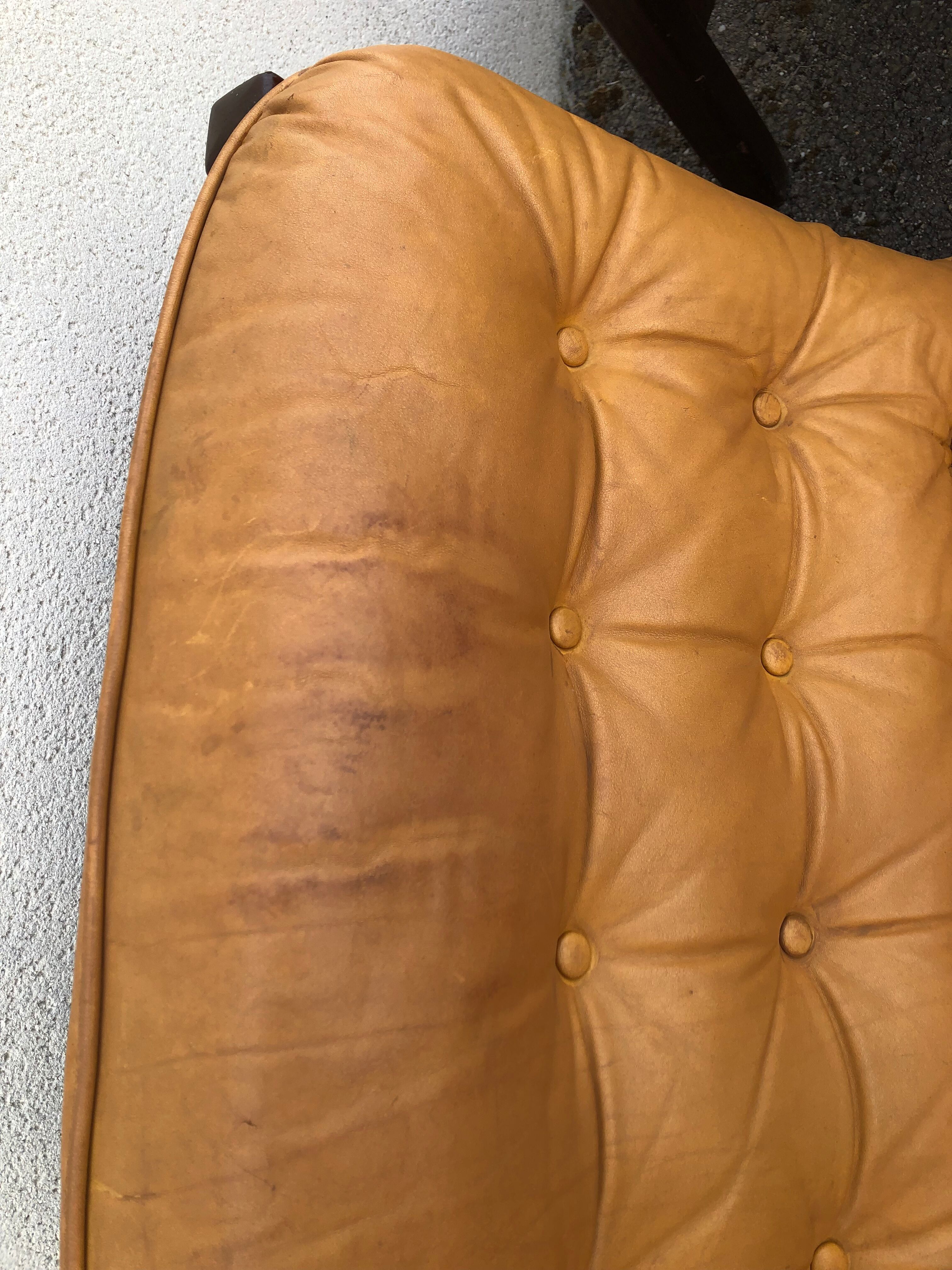 Leather and wood armchairs 70s