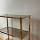 Brass and smoked glass library shelves