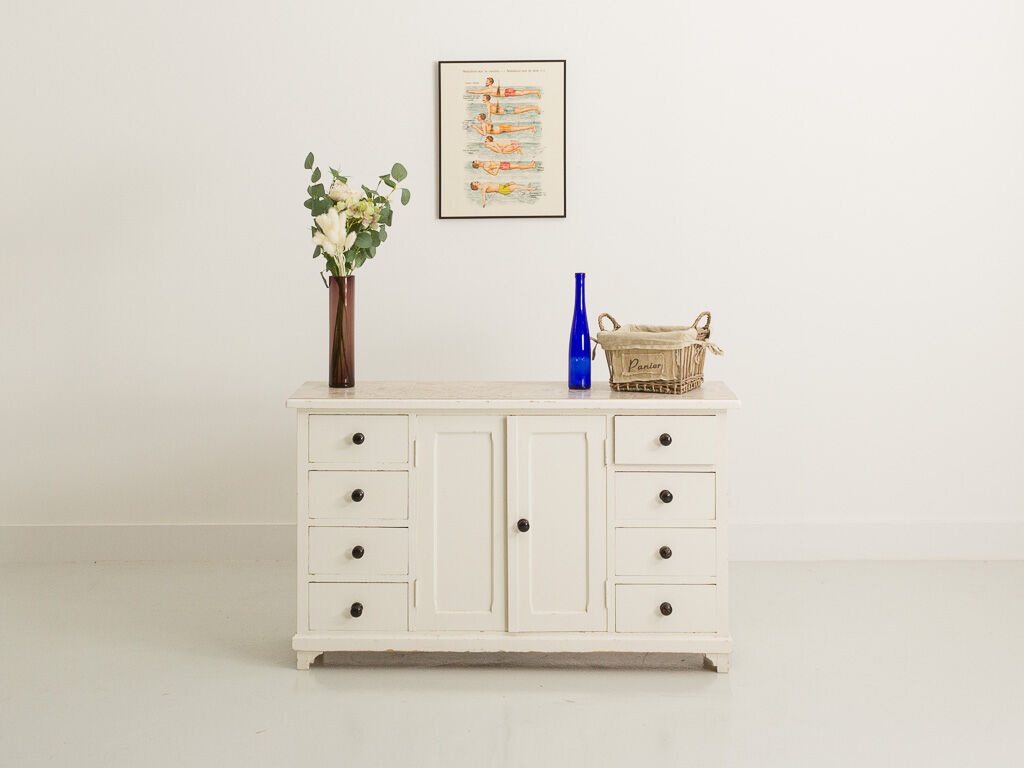Small accent cabinet with drawers and swing doors