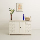 Small accent cabinet with drawers and swing doors