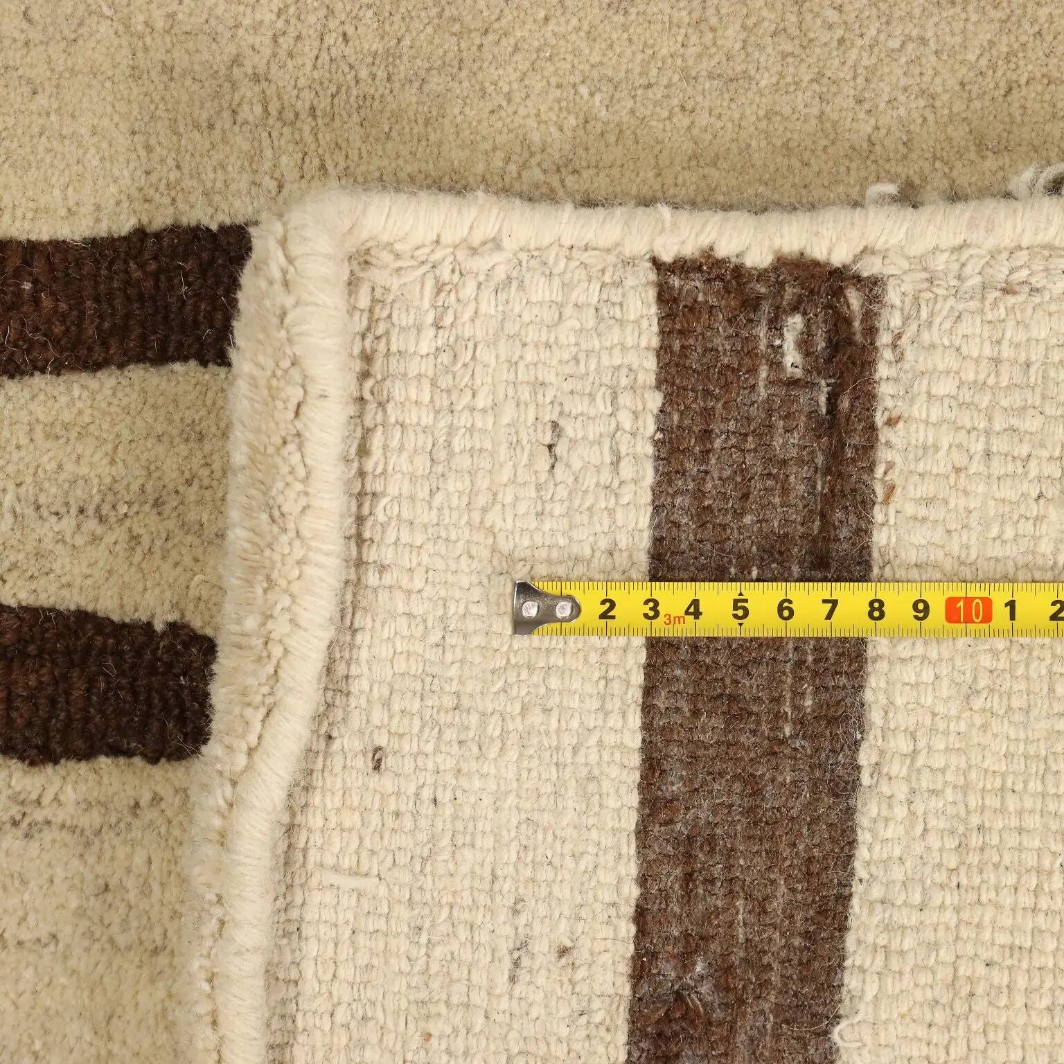 Handmade Asian wool rug with large knots 108 x 100 in