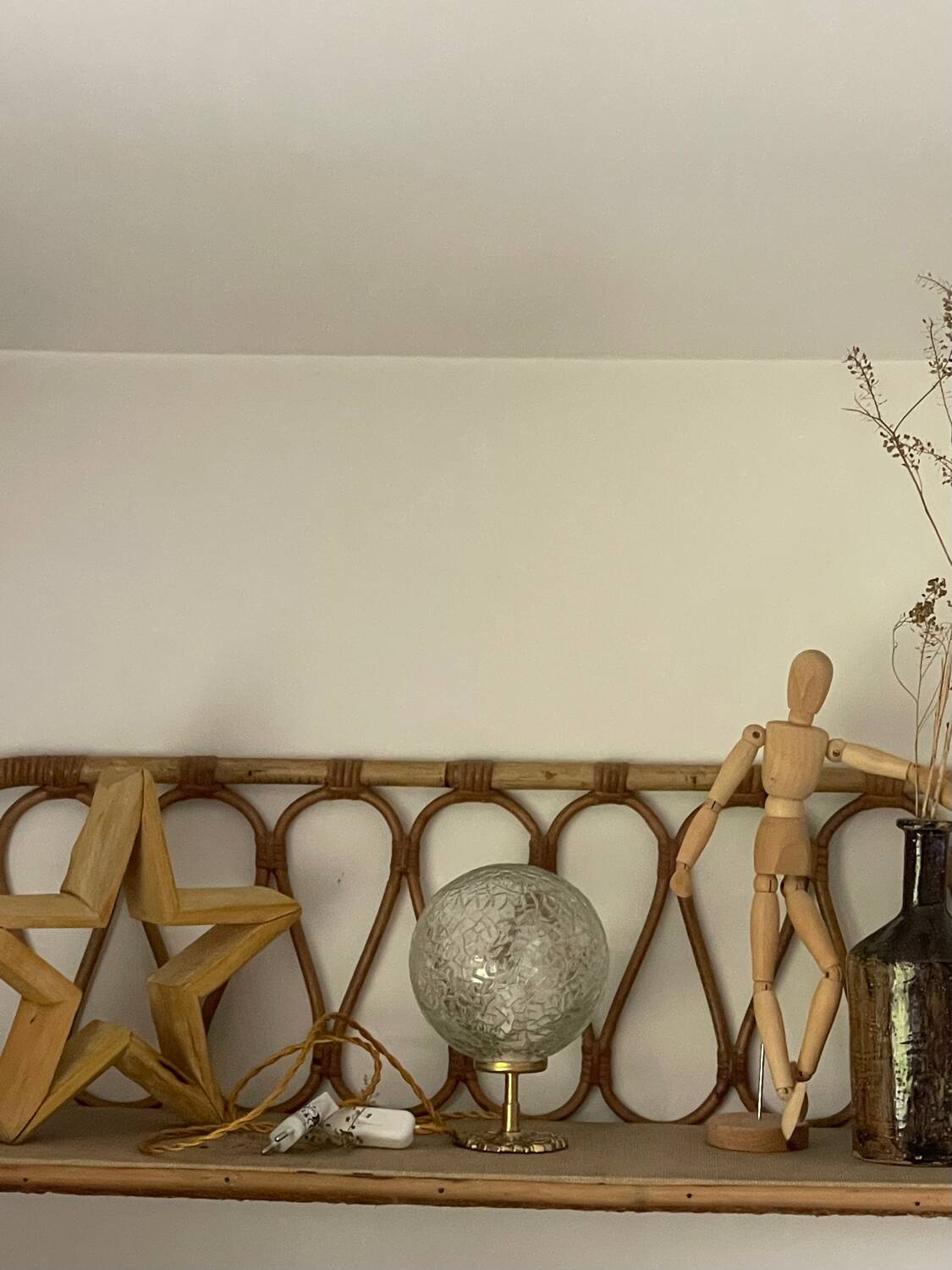 Small handcrafted globe lamp with a cracked finish and a golden brass base.