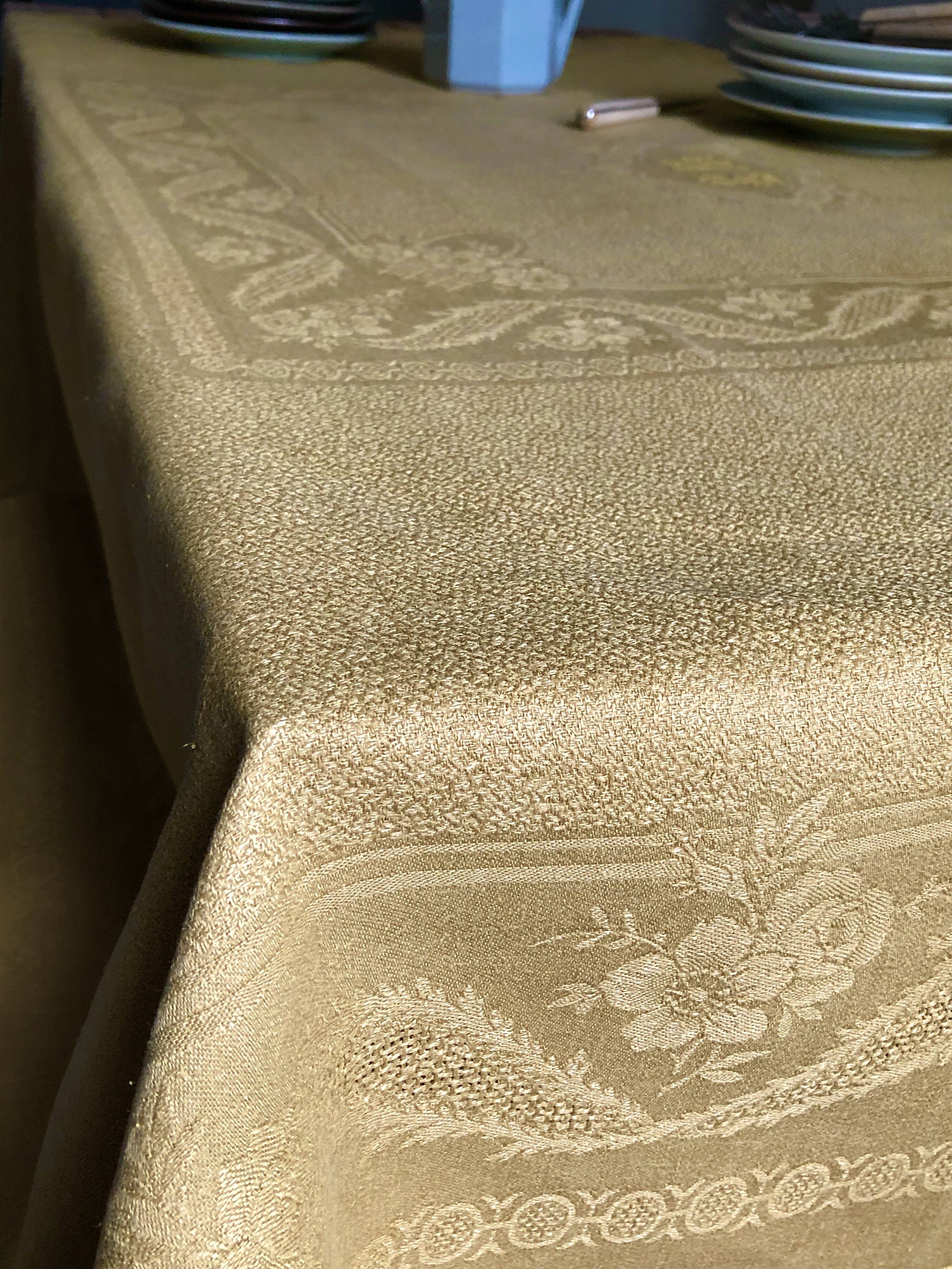 Old linen tablecloth and evening tinted in vermeil