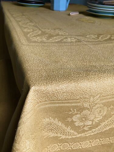 Old linen tablecloth and evening tinted in vermeil