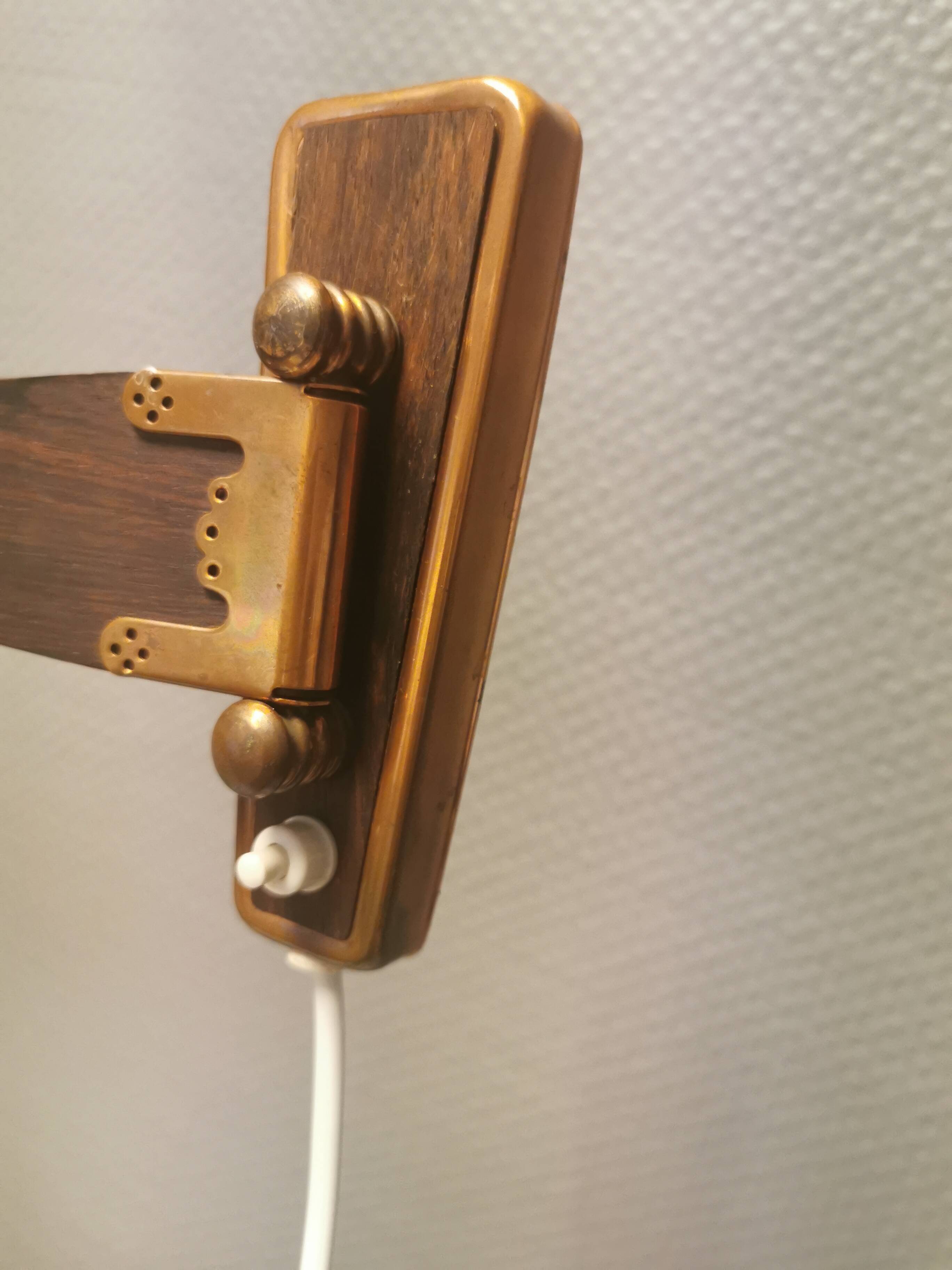 Wall lamp with adjustable ‘arm’ in copper and rosewood, with white shade.