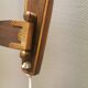 Wall lamp with adjustable ‘arm’ in copper and rosewood, with white shade.