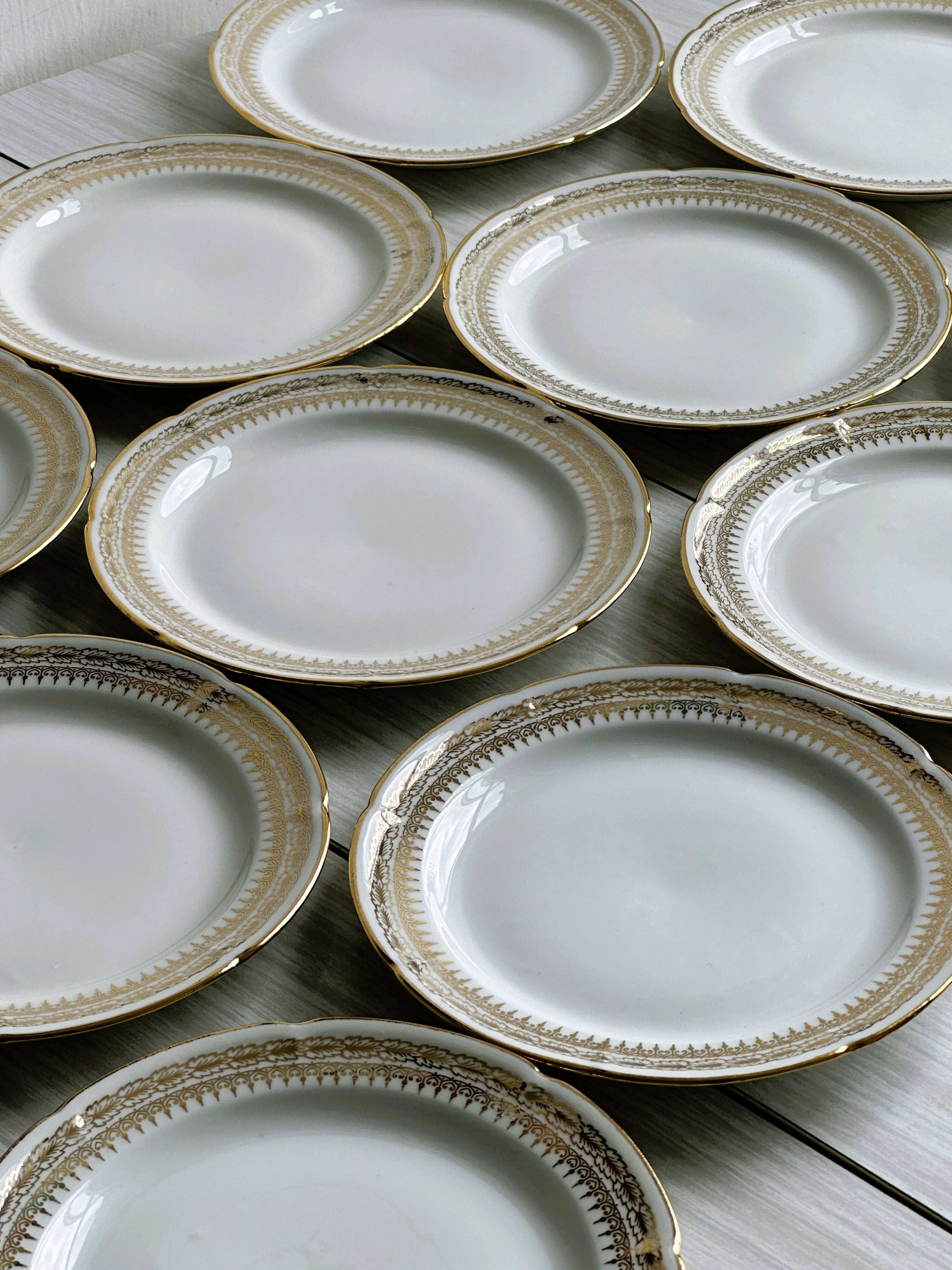 12 Limoges porcelain dessert plates, gold decoration.