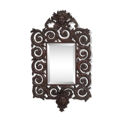 Miroir mural antique en bronze coulé représentant une tête de femme