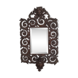 Miroir mural antique en bronze coulé représentant une tête de femme