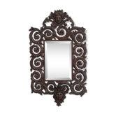 Miroir mural antique en bronze coulé représentant une tête de femme