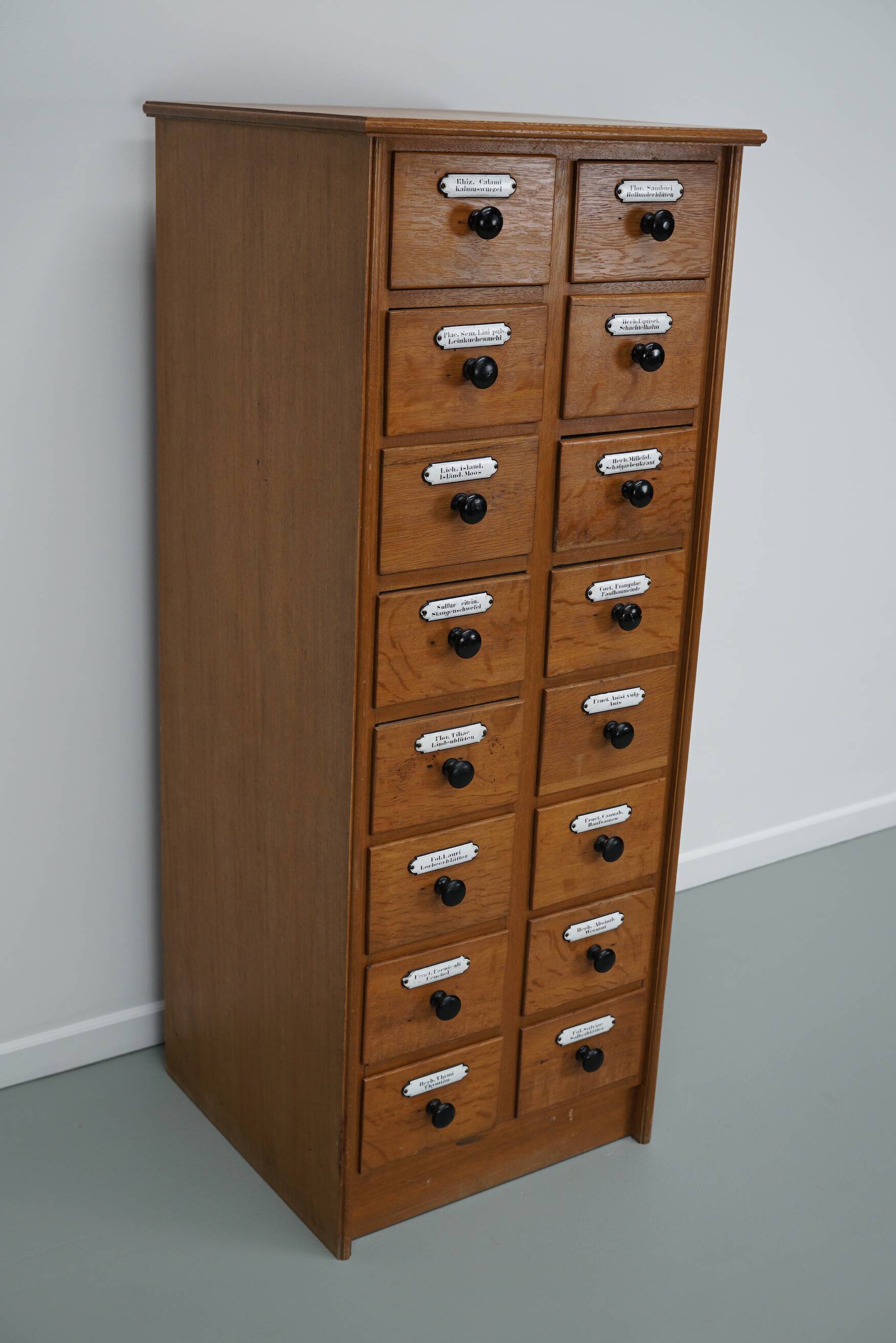 German Oak Apothecary Cabinet with Enamel Shields, 1940s