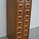 German Oak Apothecary Cabinet with Enamel Shields, 1940s