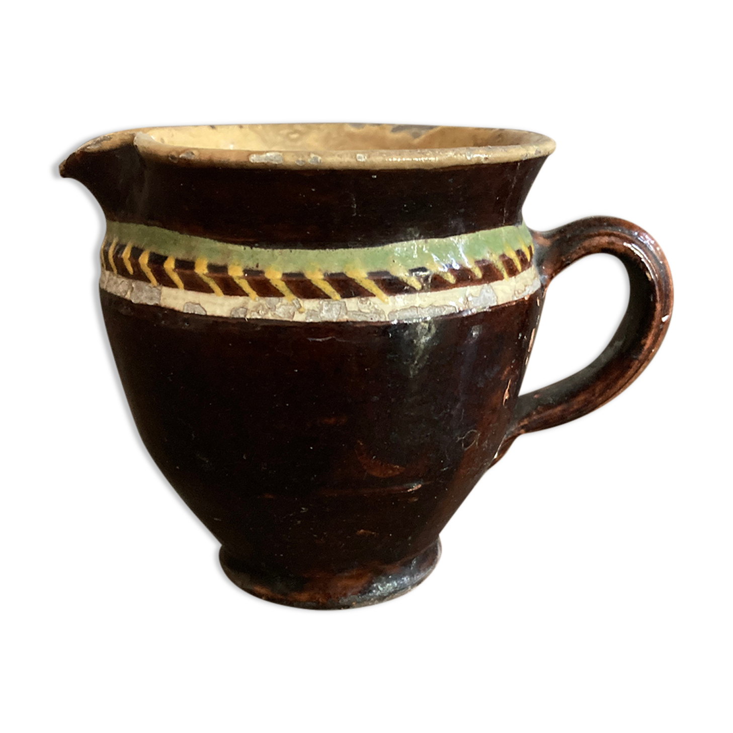 Antique pottery milk jug