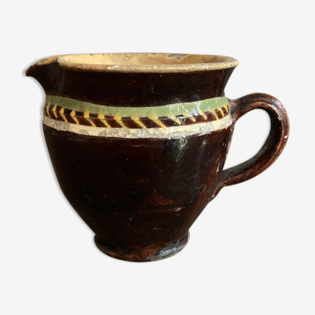 Antique pottery milk jug