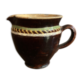 Antique pottery milk jug