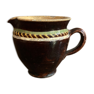 Antique pottery milk jug