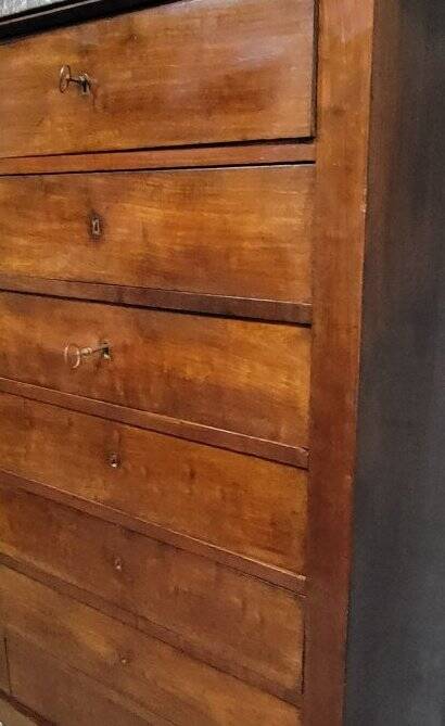 Empire Restoration period chest of drawers in mahogany, with a marble top.