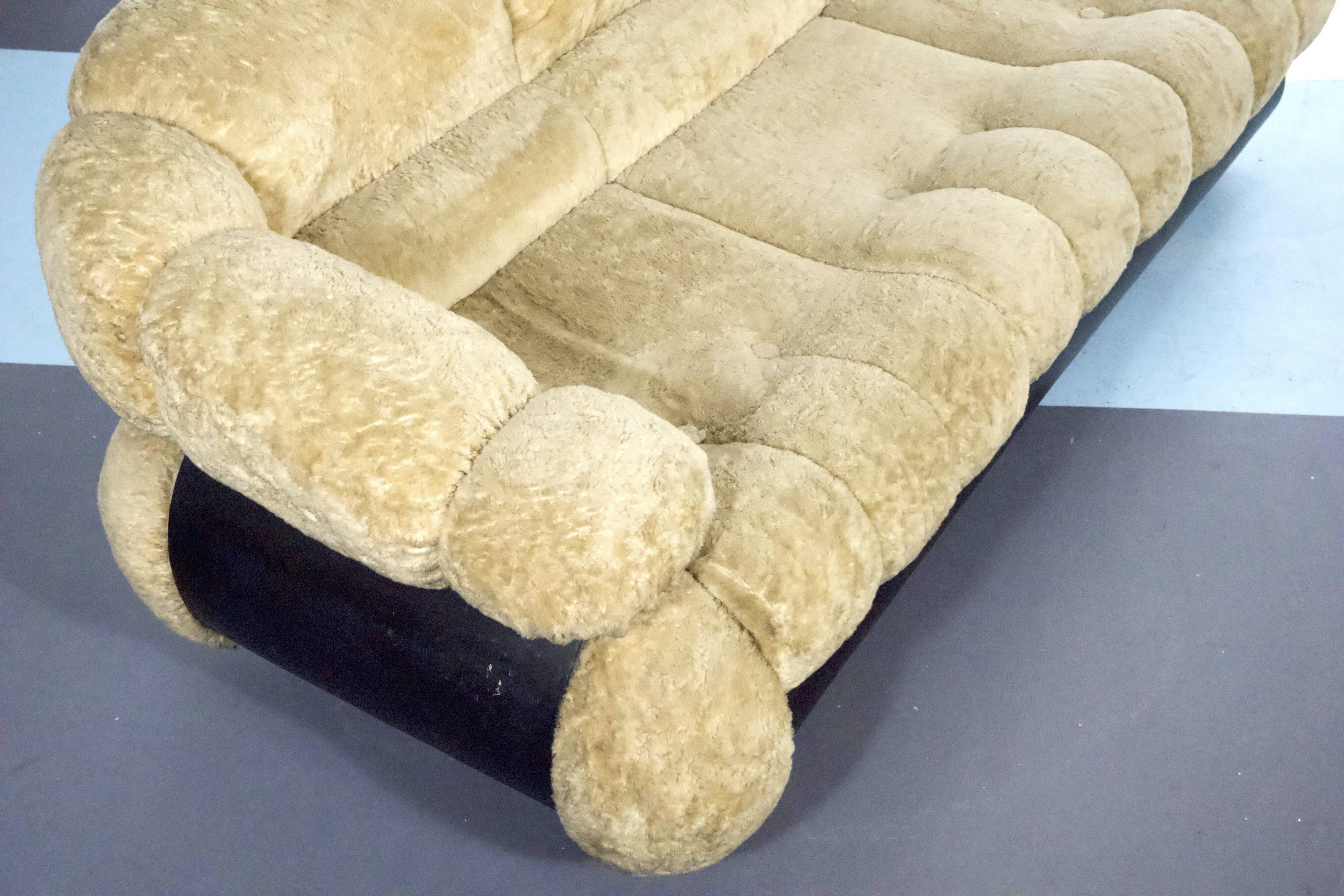 three-seater sofa designed by Adriano Piazzesi, produced in Italy during the 1970s. Upholster