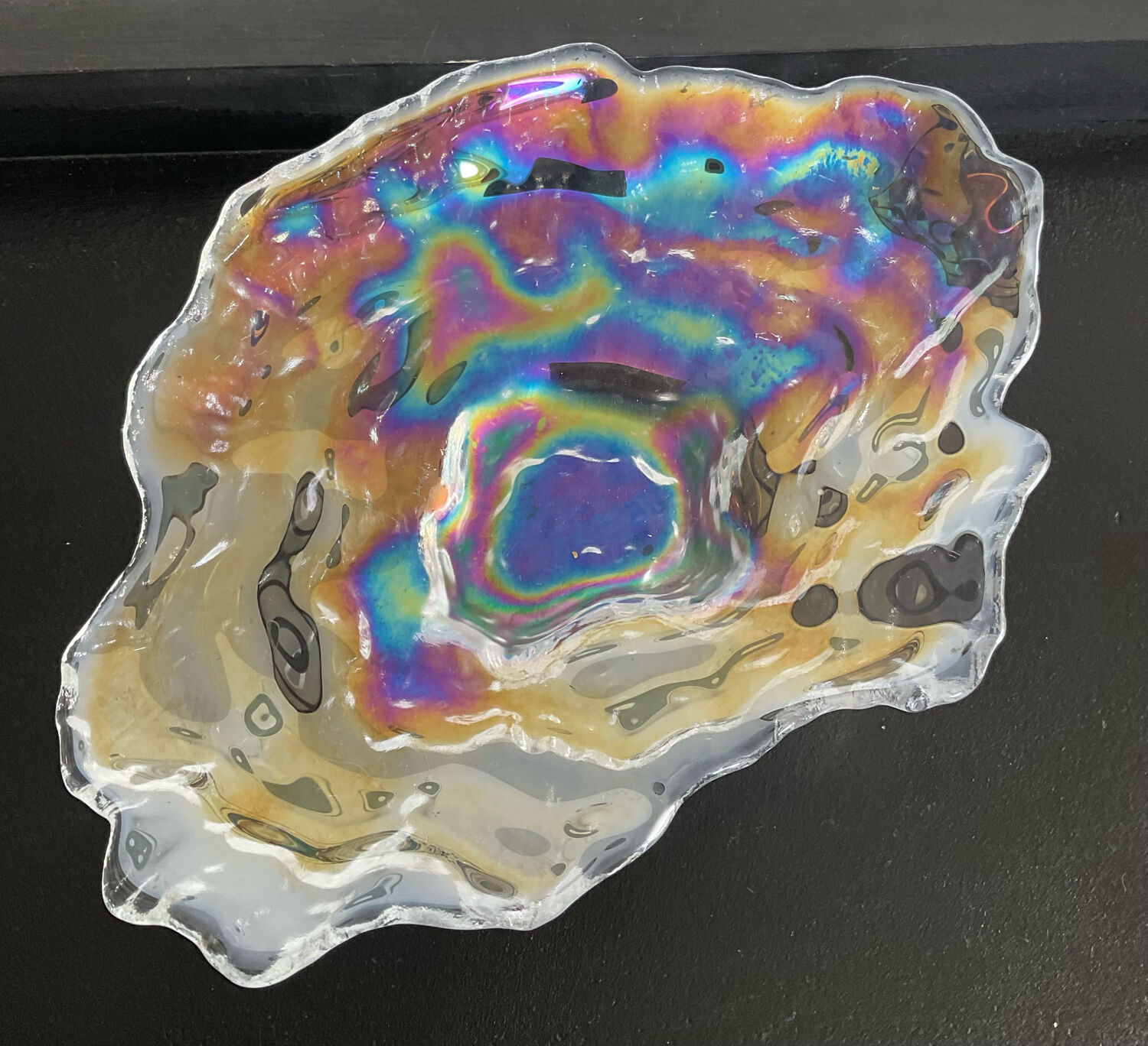 Empty vintage pocket in iridescent glass