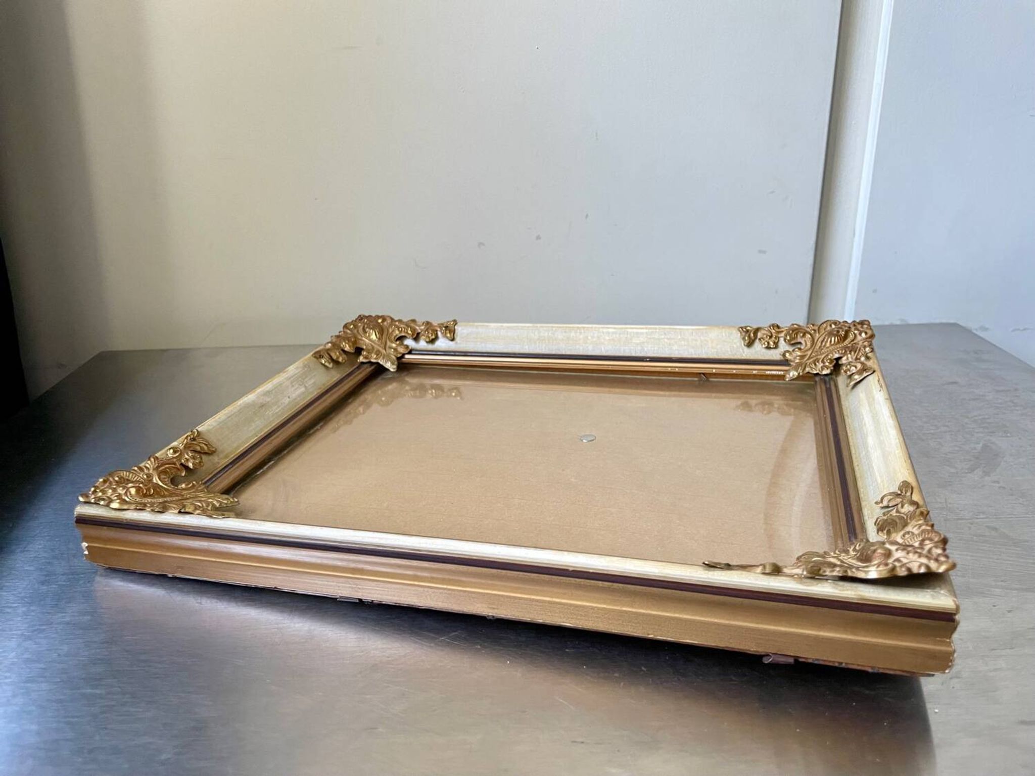 Antique wooden frame with metal gold colored details 28 cm x 22 cm convex glass