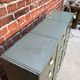 Vintage industrial furniture with metal clamshell atal