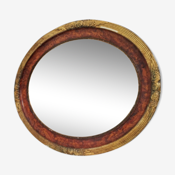 Golden oval art deco mirror