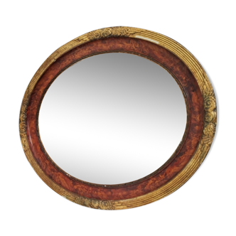 Golden oval art deco mirror