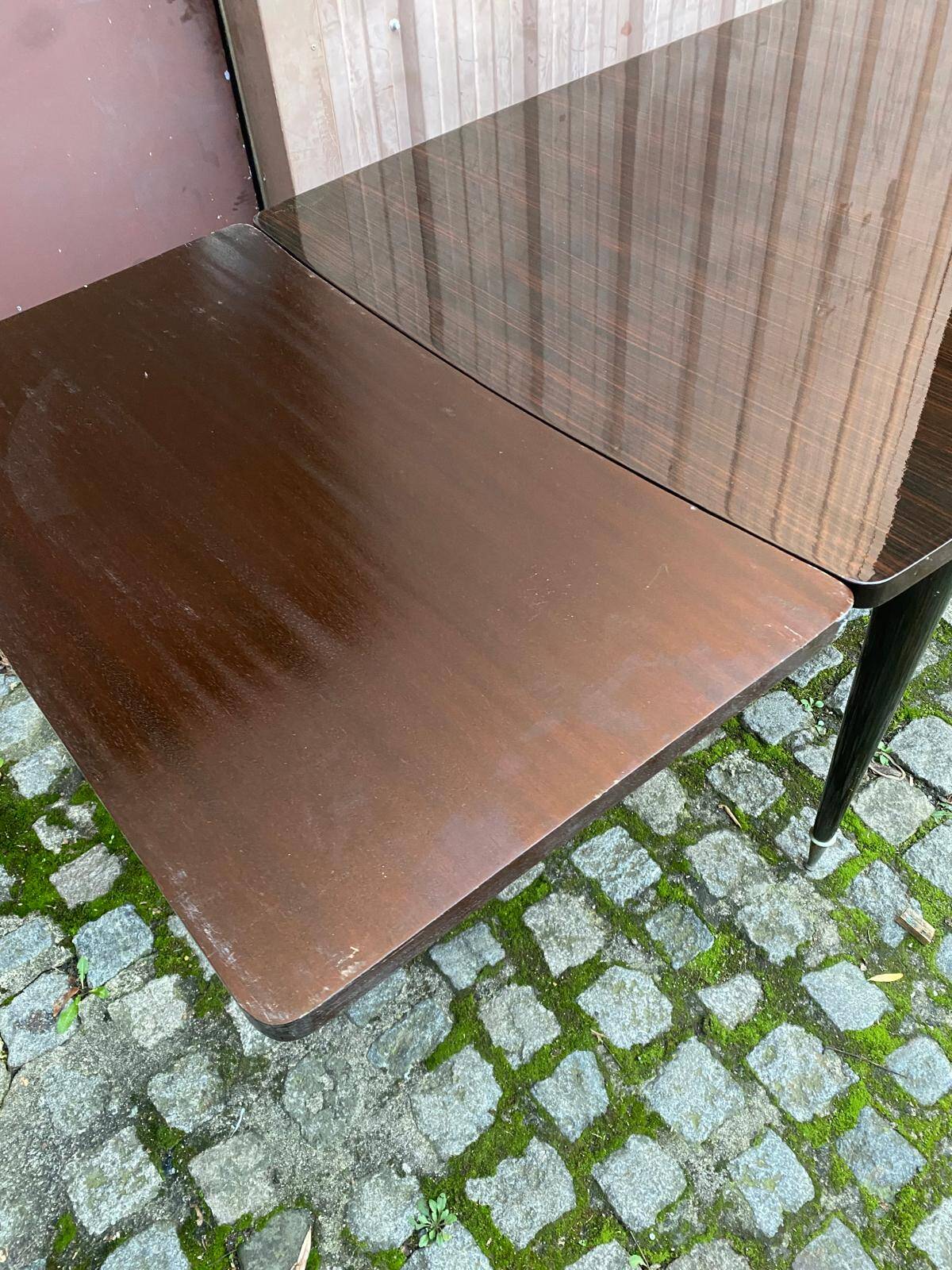 Scandinavian extendable dining table made of solid wood and rosewood effect.