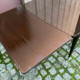 Scandinavian extendable dining table made of solid wood and rosewood effect.