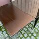 Scandinavian extendable dining table made of solid wood and rosewood effect.