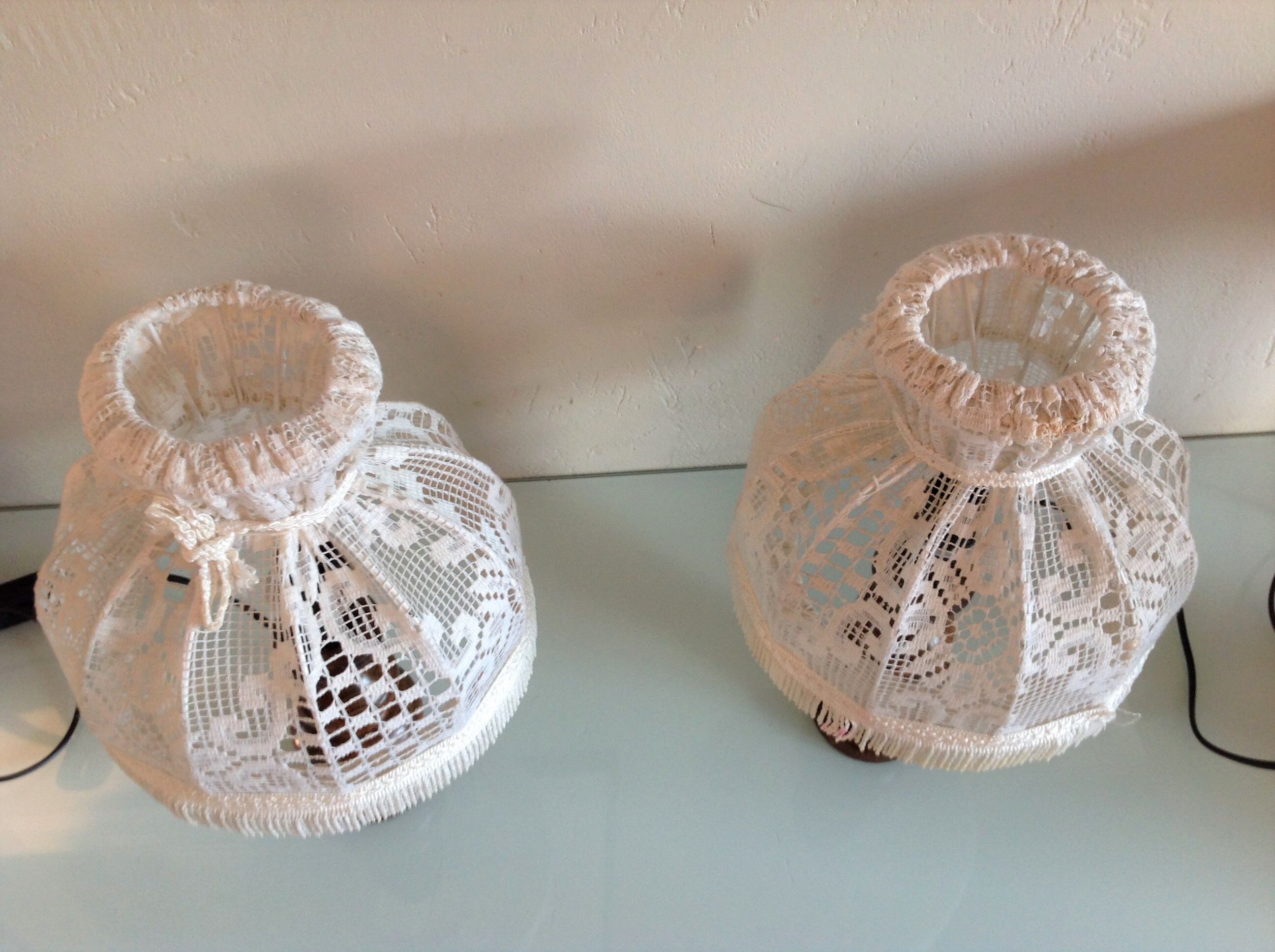 Pair of turned wooden bedside lamps and lace/vintage lampshade 60s-70s