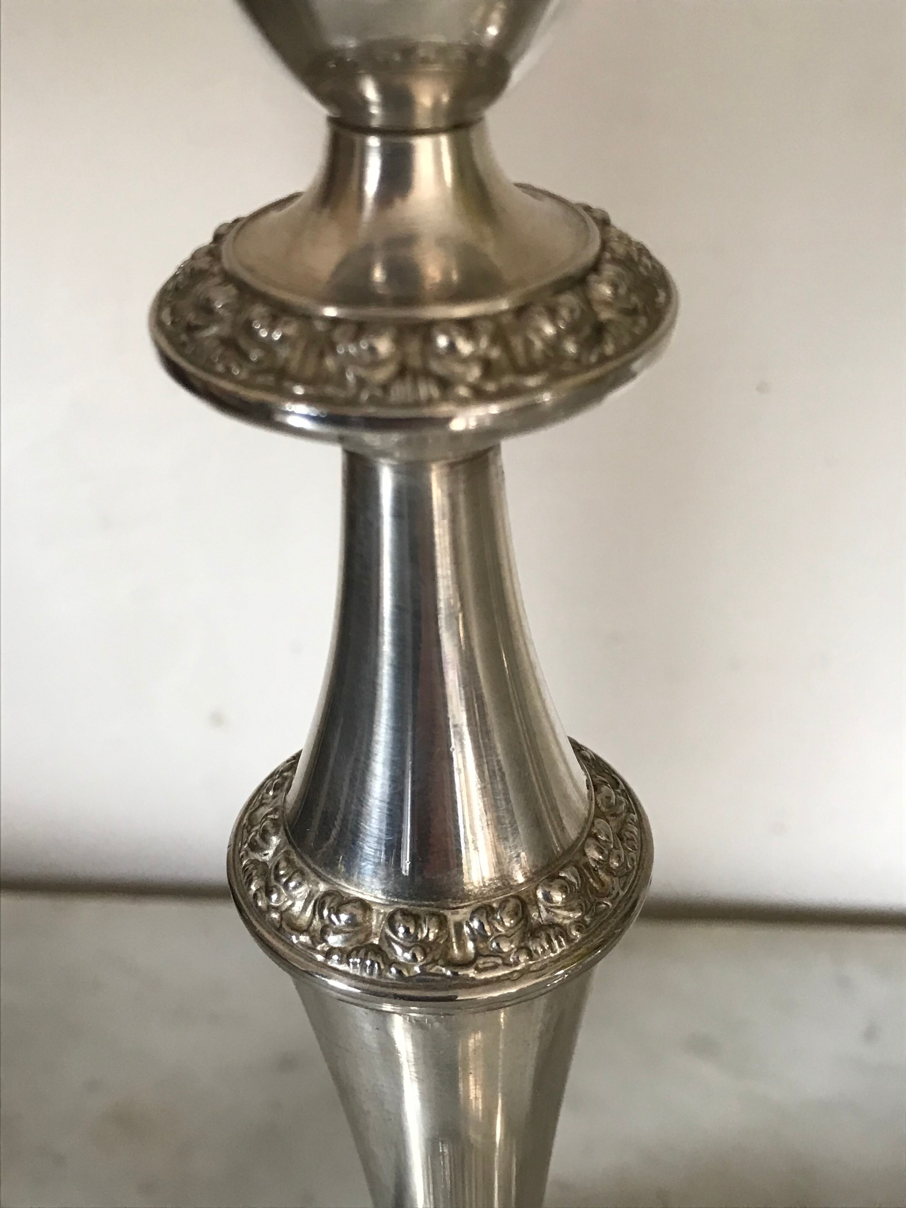 Pair of silver metal candlesticks