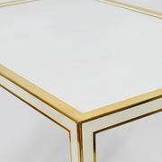 A pair of brass and white mirror tables from Vereinigte Werkstätten, Germany, 1970s.