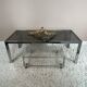 Table basse chromée et verre fumé années 70