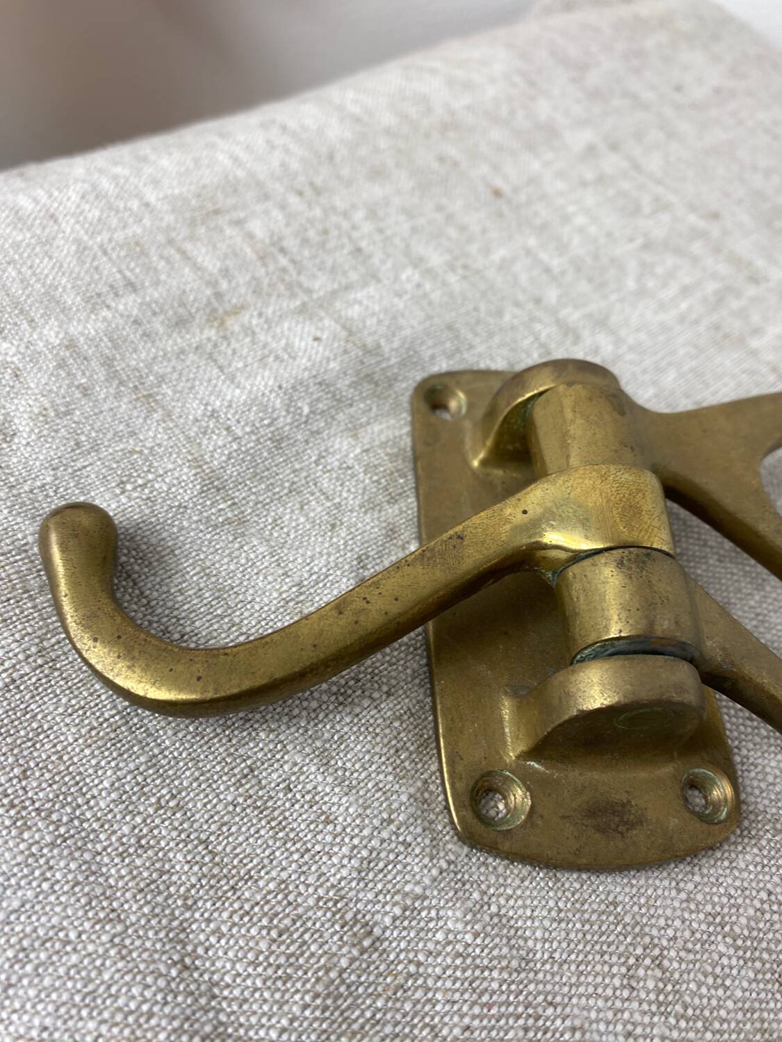 Three-pronged folding brass coat hook