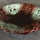 Ceramic fruit bowl centrepiece with grape cluster decoration, numbered.