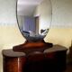 Coiffeuse art deco avec miroir biseauté de forme ovale