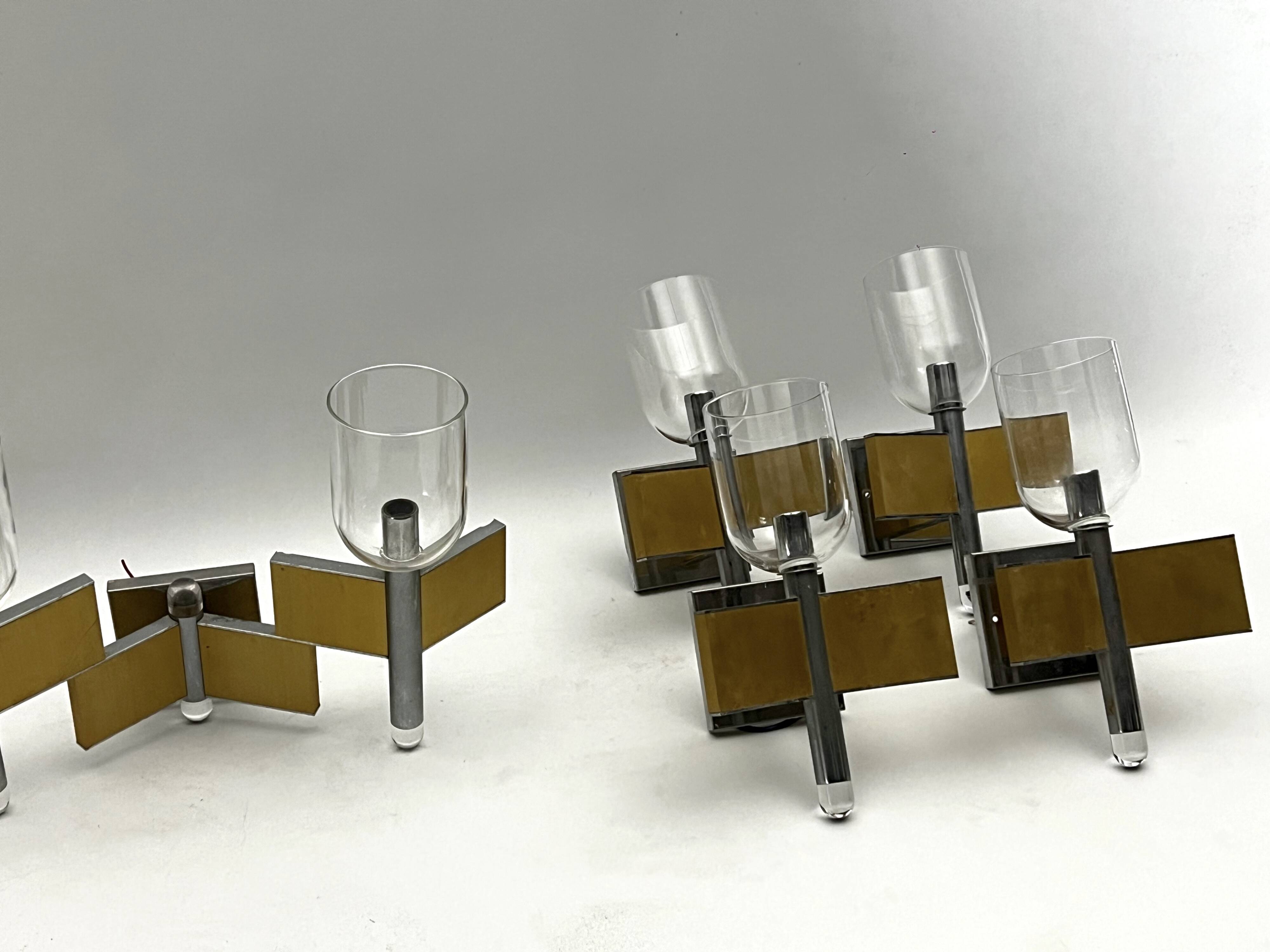 Mid-Century Modern set of eight brass and chrome sconces by Sciolari. Italy 1970s