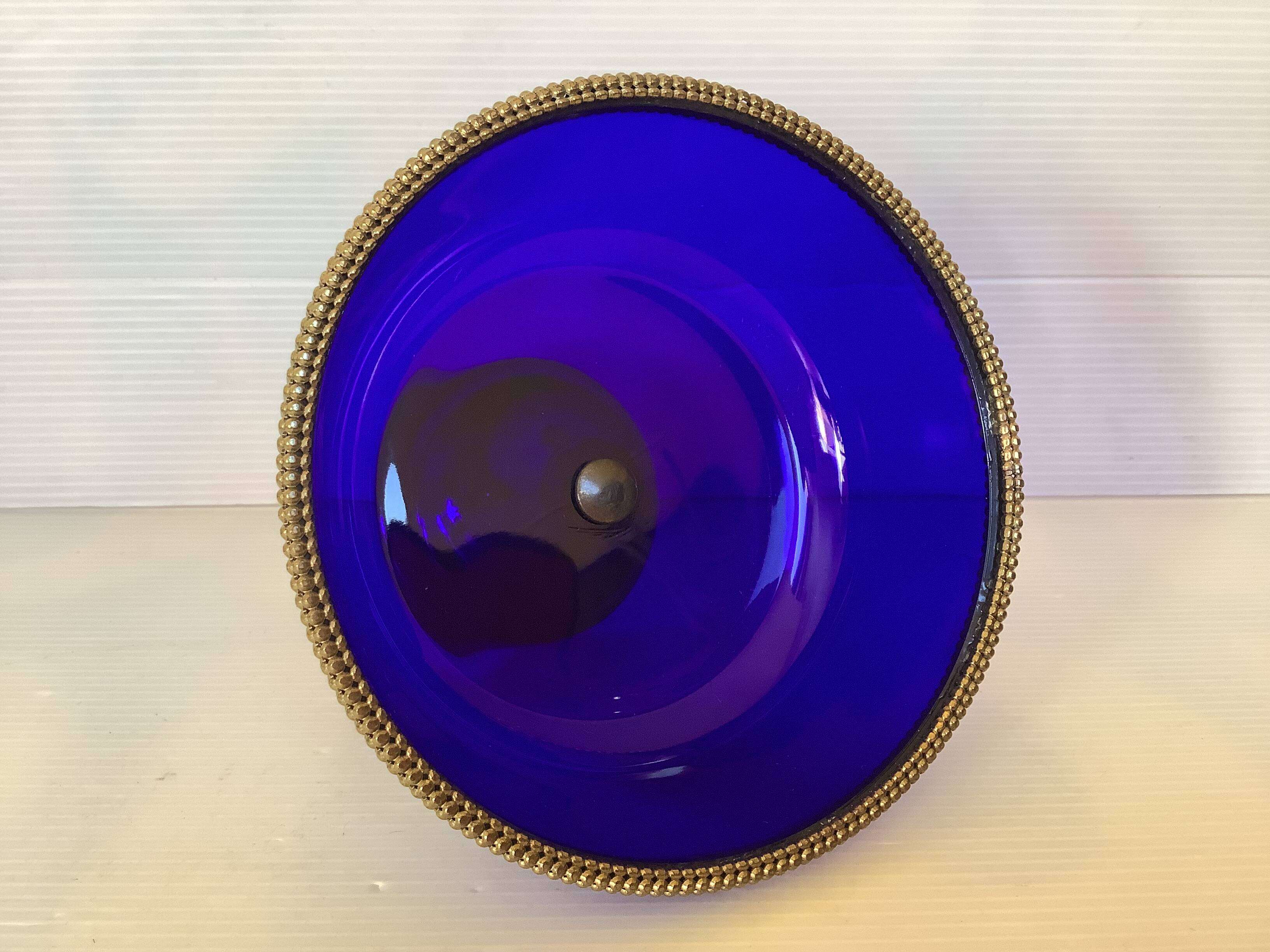 Cobalt blue trinket dish with a beaded pattern.