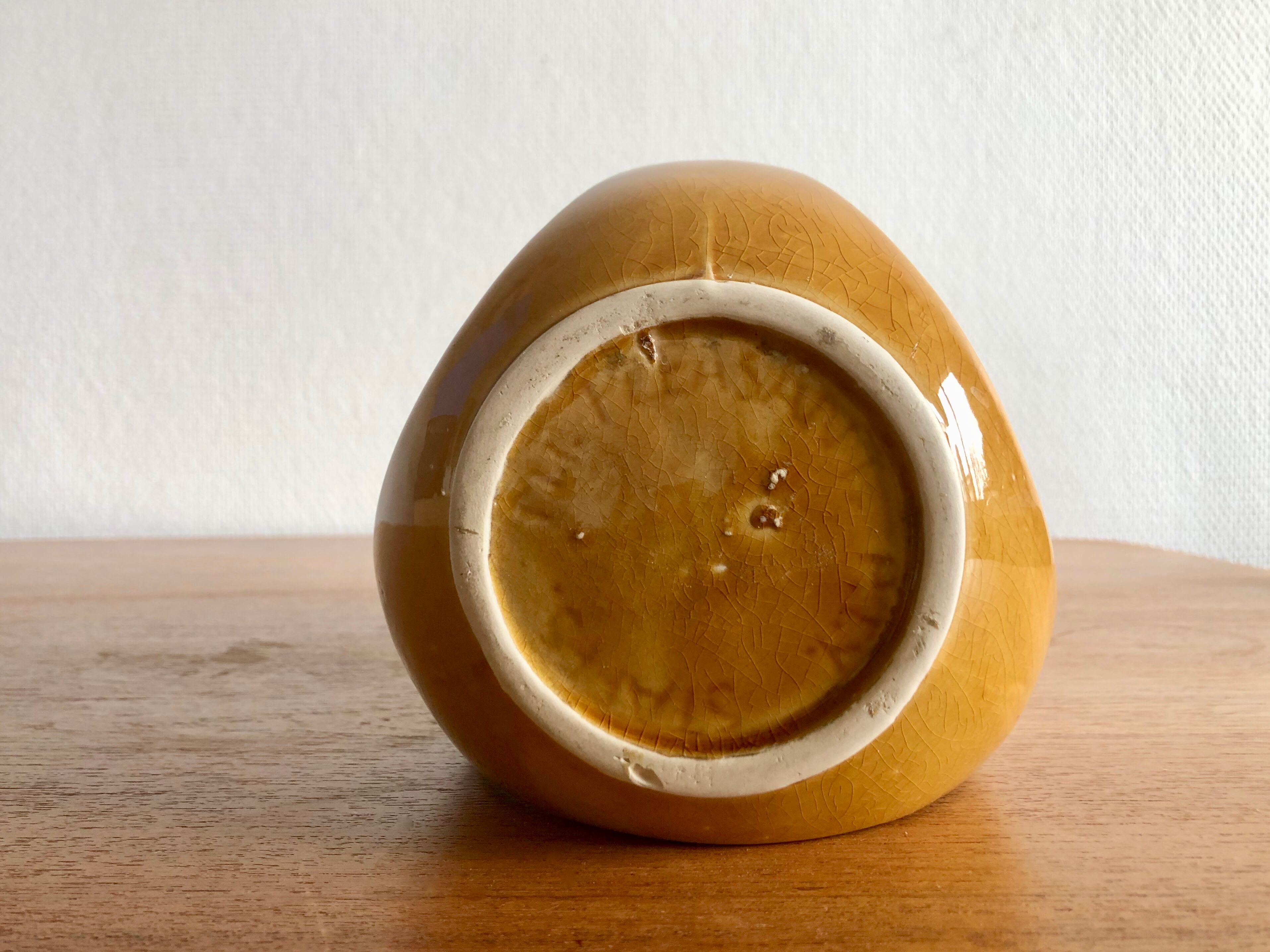 Mustard yellow ceramic pitcher