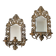 Pair of mirror wall sconces with brass candle holders.