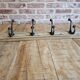 Solid teak coat hook with 4 double cast iron hooks
