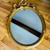 Miroir ancien ovale a fronton noeud