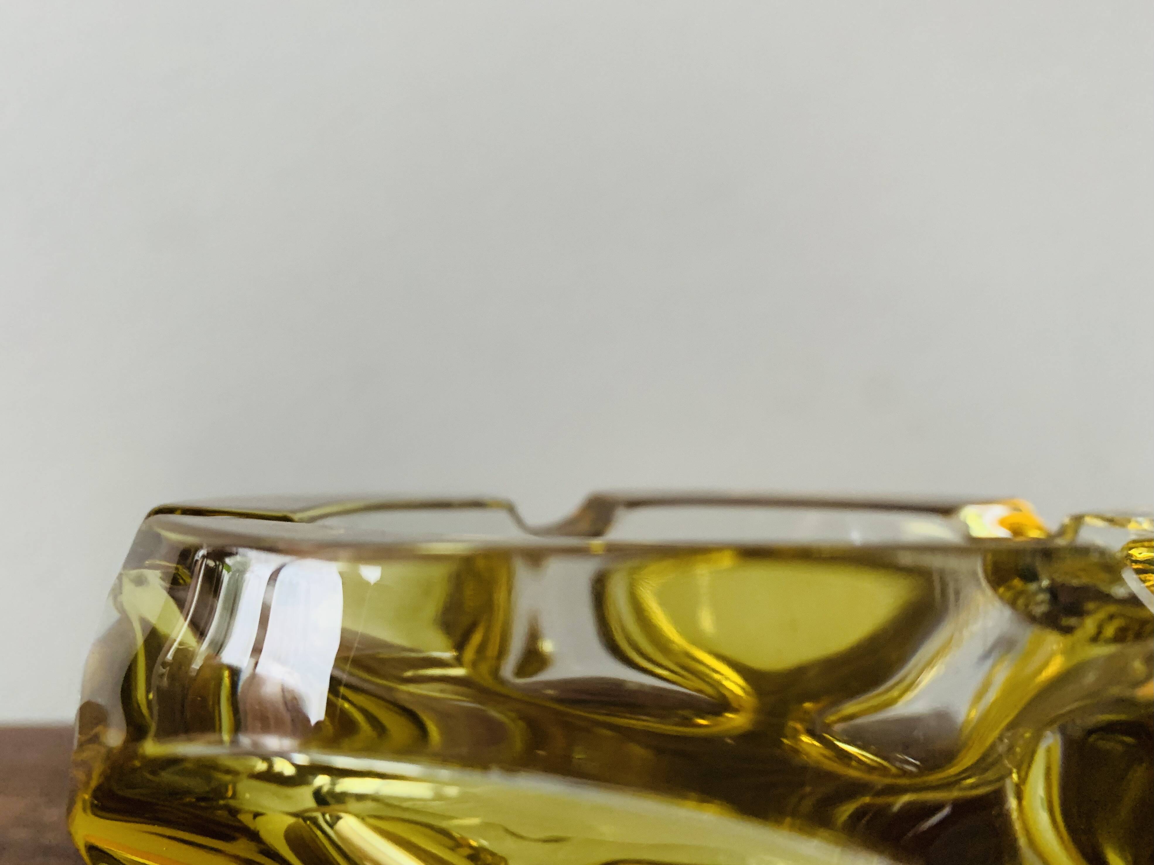 Vintage ashtray in yellow and transparent molded glass