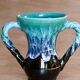 Ancient amphora vase in turquoise glazed stoneware.
