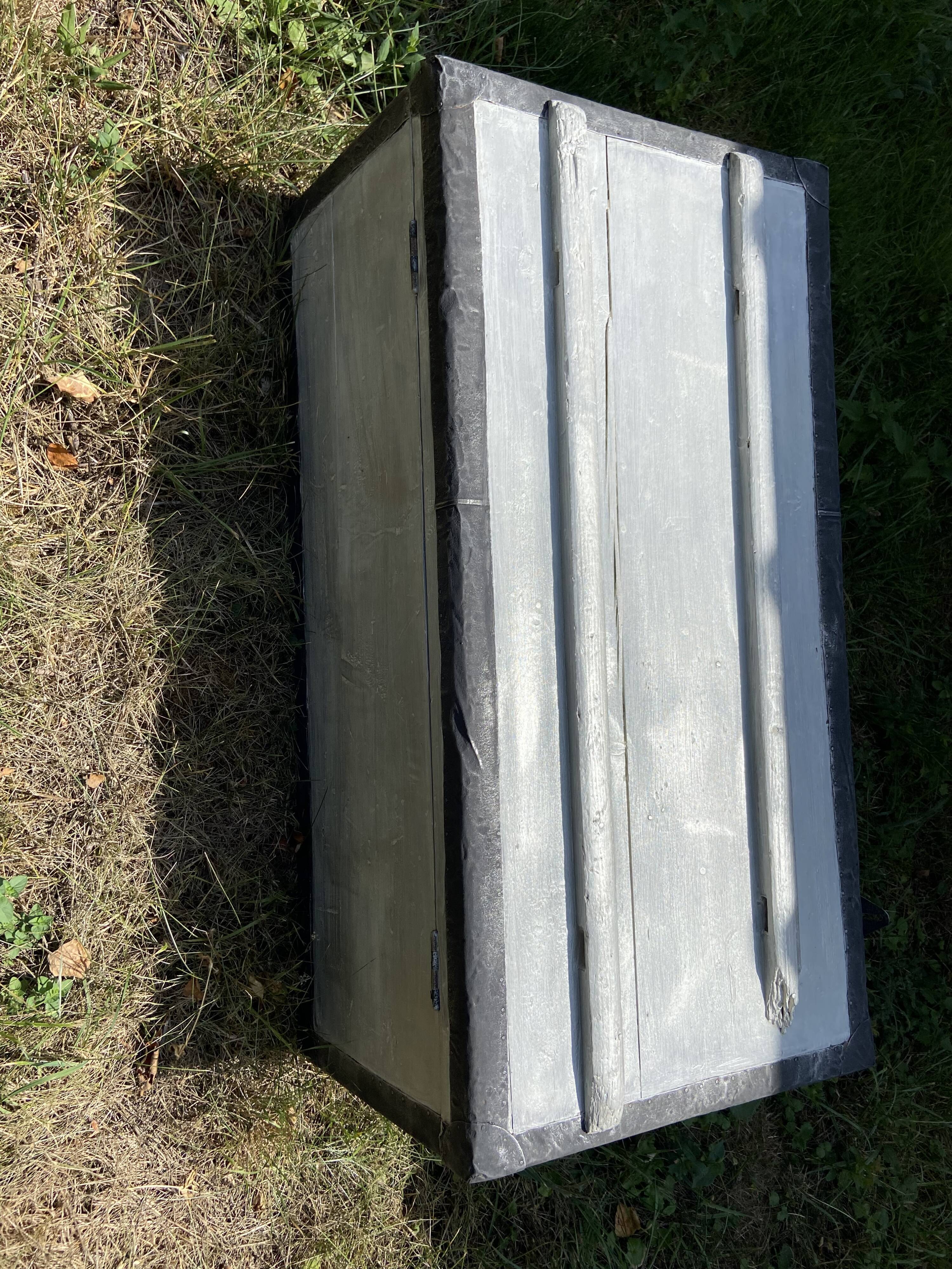 Restored wooden trunk patinated grey