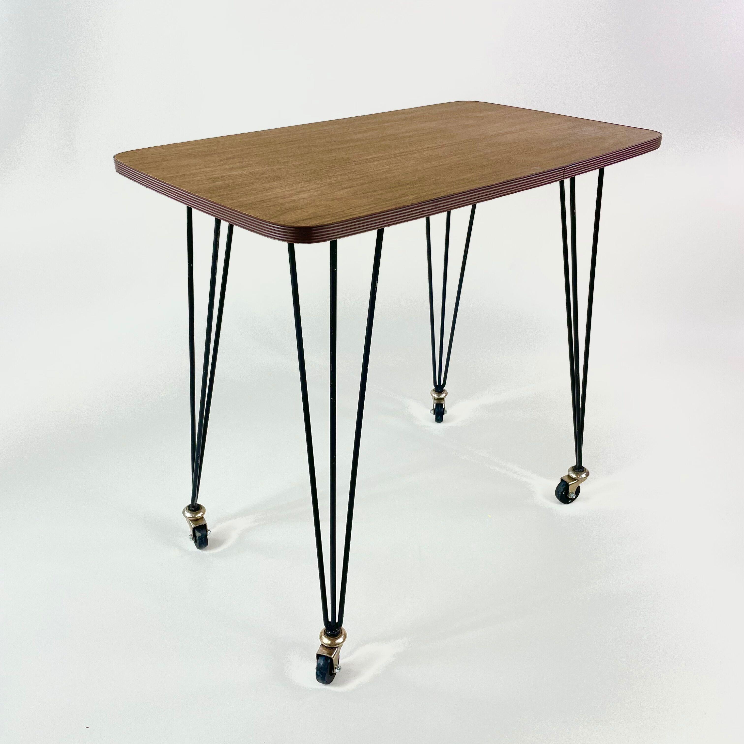 Table on wheels, laminate top and metal Eiffel legs, circa 1950